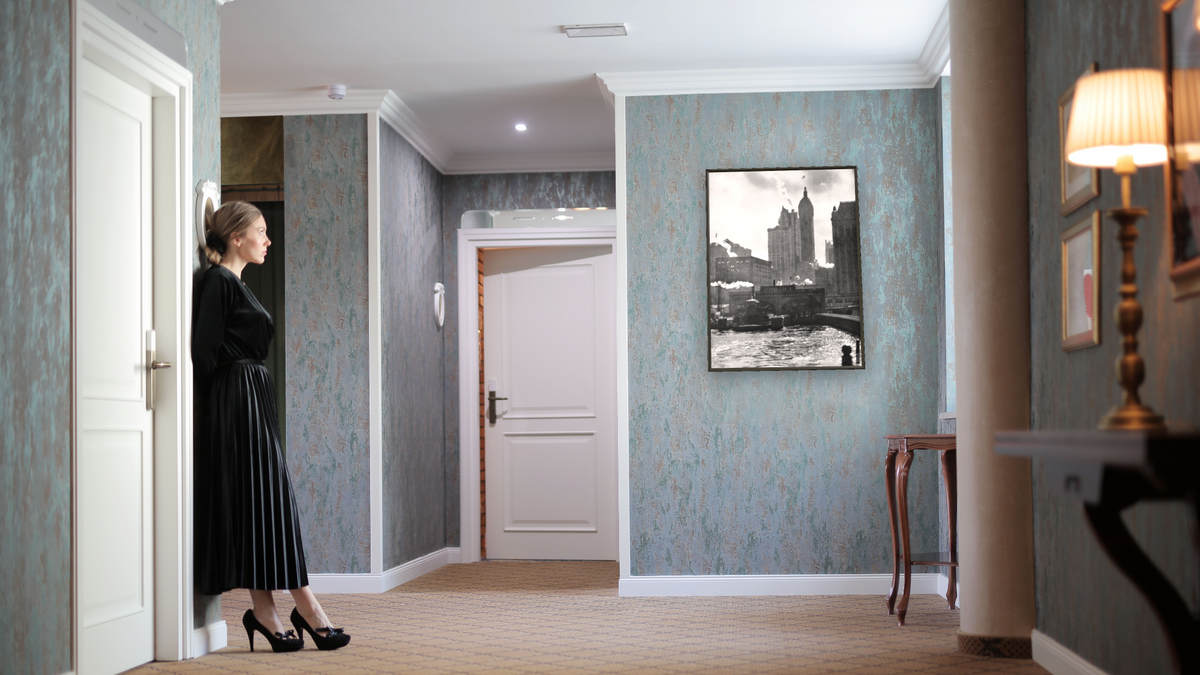 The City of Ambition by Alfred Stieglitz, shown at 30 × 40 in (76.2 × 101.6 cm) on canvas in Ramino Satin Black, hotel lobby