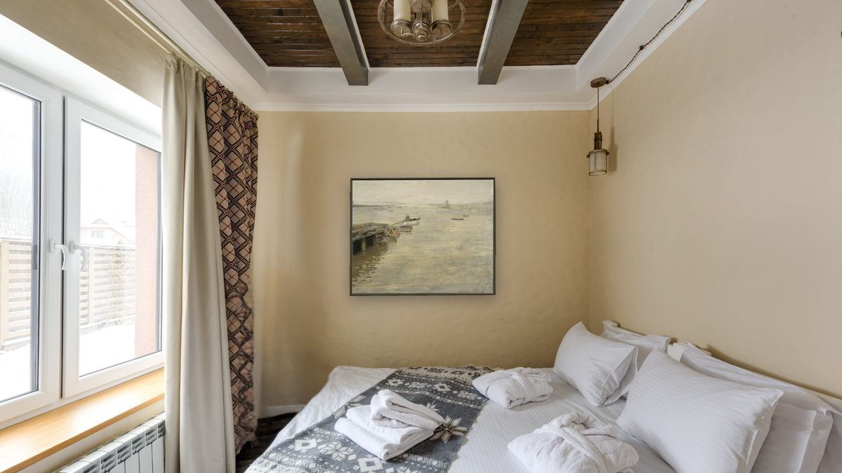 A Gray Day by William Merritt Chase, shown at 32 × 40 in (81.3 × 101.6 cm) on canvas in Ramino Satin Black, hotel guest room