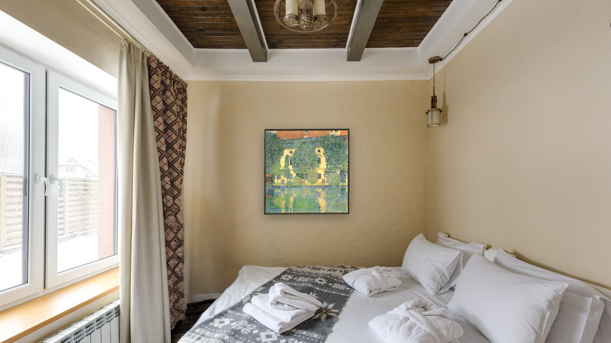 The Schloss Kammer on the Attersee III by Gustav Klimt, shown at 32 × 32 in (81.3 × 81.3 cm) on canvas in Ramino Satin Black, hotel guest room