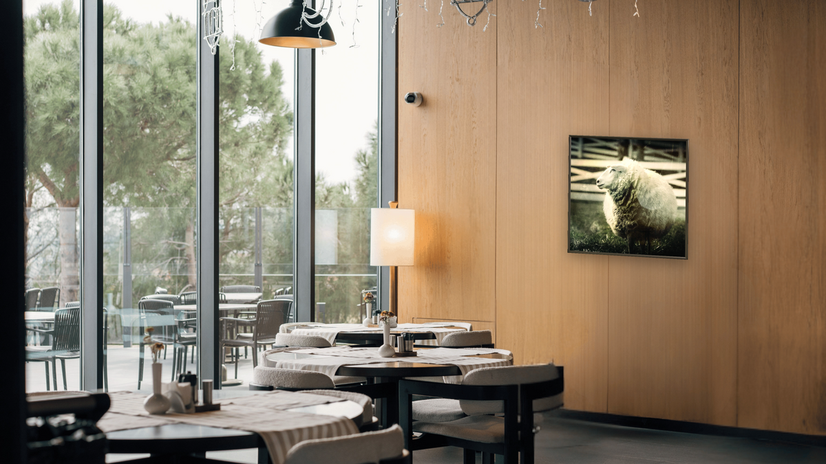 sheep by Brandon Luther, shown at 32 × 32 in (81.3 × 81.3 cm) on canvas in Ramino Satin Black, restaurant