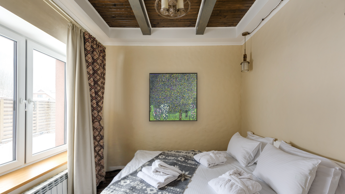 Roses under the Trees by Gustav Klimt, shown at 32 × 32 in (81.3 × 81.3 cm) on canvas in Ramino Satin Black, hotel guest room
