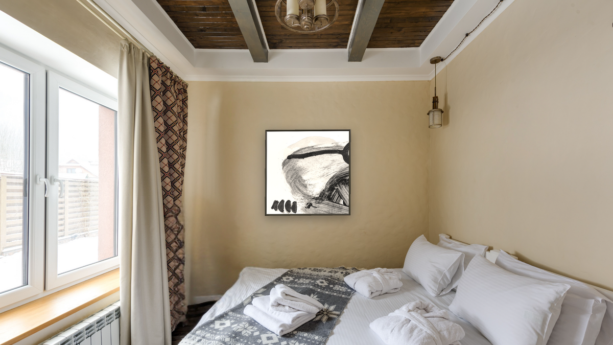 Black White Set 1 by Dan Hobday, shown at 32 × 32 in (81.3 × 81.3 cm) on canvas in Ramino Satin Black, hotel guest room
