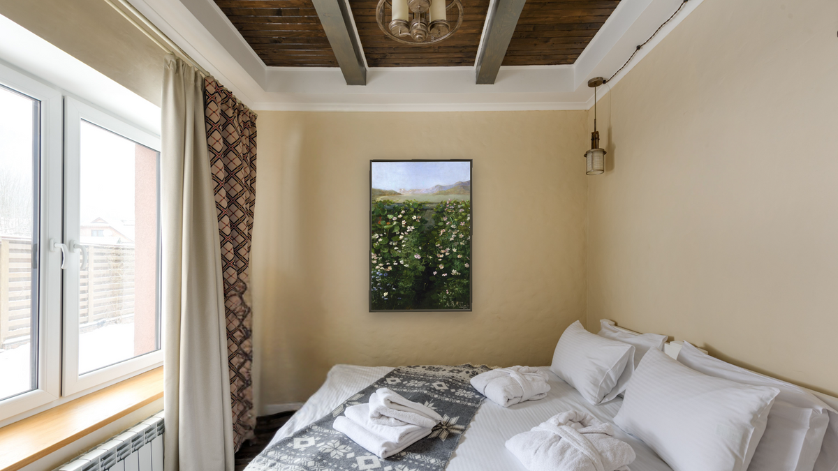 San Francisco Garden by Alberta Binford McCloskey, shown at 28 × 42 in (71.1 × 106.7 cm) on canvas in Ramino Satin Black, hotel guest room