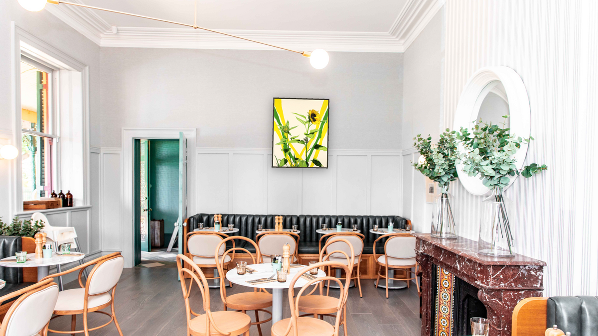 Sunflowers by Alexis Rockman, shown at 32 × 40 in (81.3 × 101.6 cm) on canvas in Ramino Satin Black, restaurant