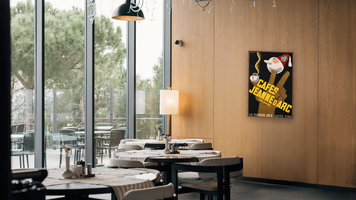 Cafes Jeanne d'Arc Poster by Carl Chew, shown at 28 × 42 in (71.1 × 106.7 cm) on canvas in Arber Warm Walnut, restaurant