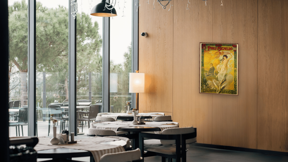 Pneu Michelin Advertisement Poster, shown at 30 × 40 in (76.2 × 101.6 cm) on canvas in Arber Warm Walnut, restaurant