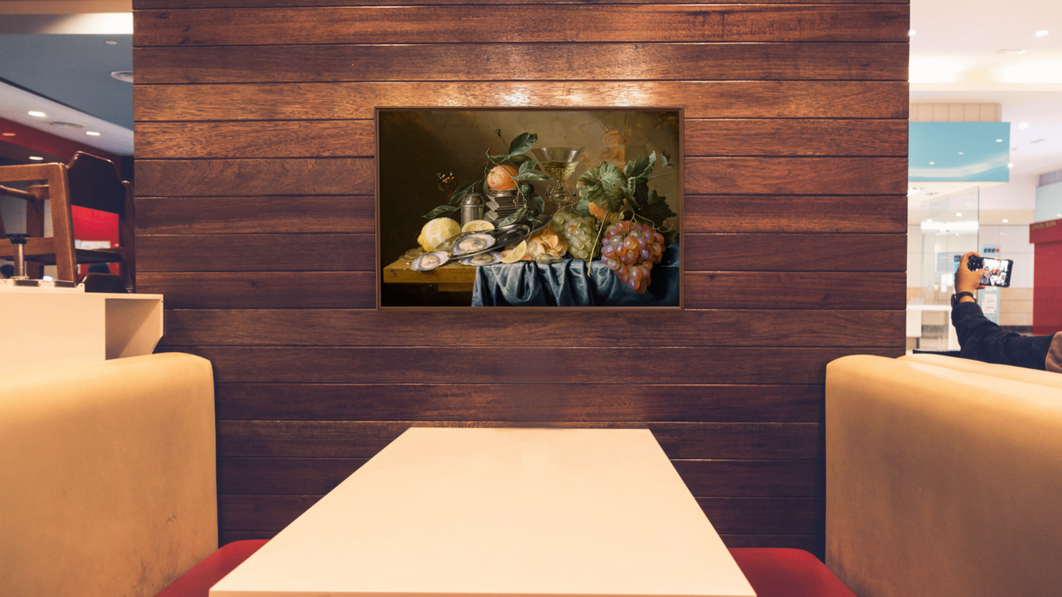 Still Life with Oysters and Grapes by Jan Davidsz de Heem, shown at 28 × 42 in (71.1 × 106.7 cm) on canvas in Arber Warm Walnut, restaurant