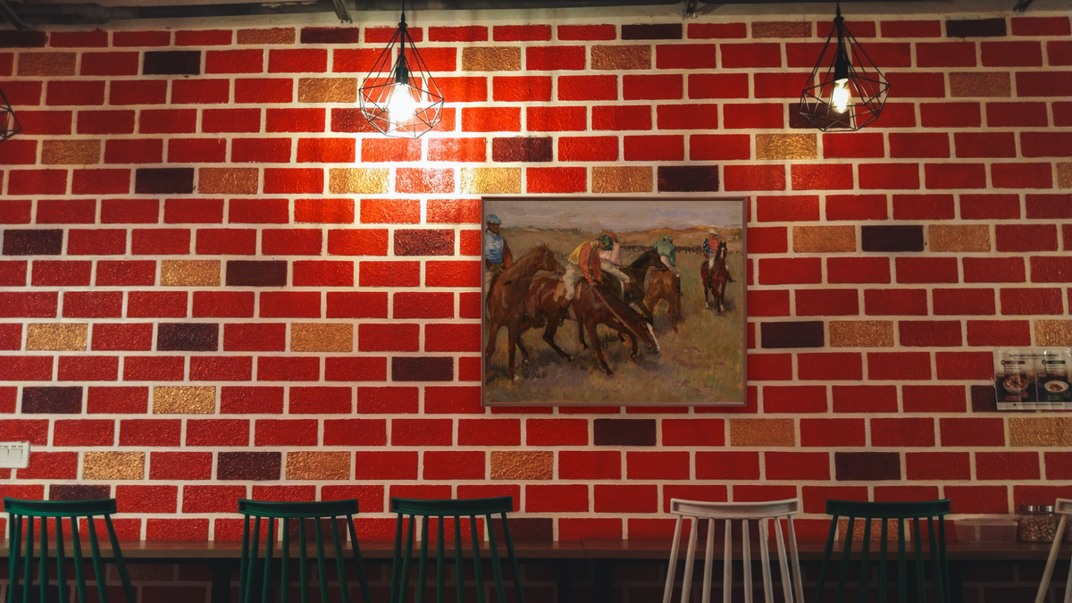 Before the Race, c. 1882 by Edgar Degas, shown at 30 × 40 in (76.2 × 101.6 cm) on canvas in Arber Warm Walnut, restaurant