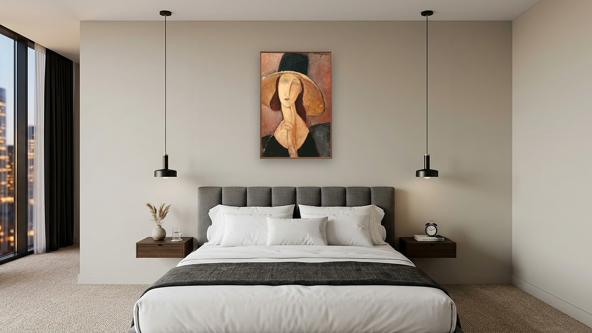 Portrait of Jeanne Hebuterne in a large hat by Amedeo Modigliani, shown at 28 × 42 in (71.1 × 106.7 cm) on canvas in Arber Warm Walnut, hotel guest room
