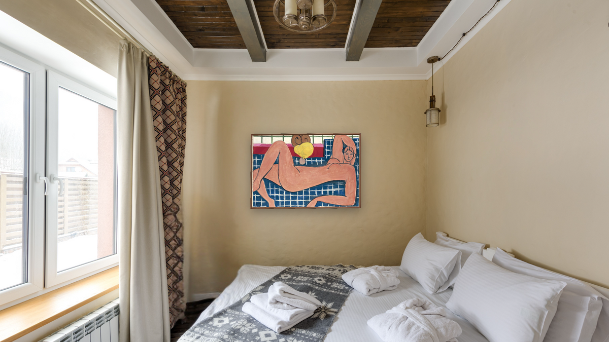 Large Reclining Nude by Henri Matisse, shown at 28 × 42 in (71.1 × 106.7 cm) on canvas in Arber Warm Walnut, hotel guest room