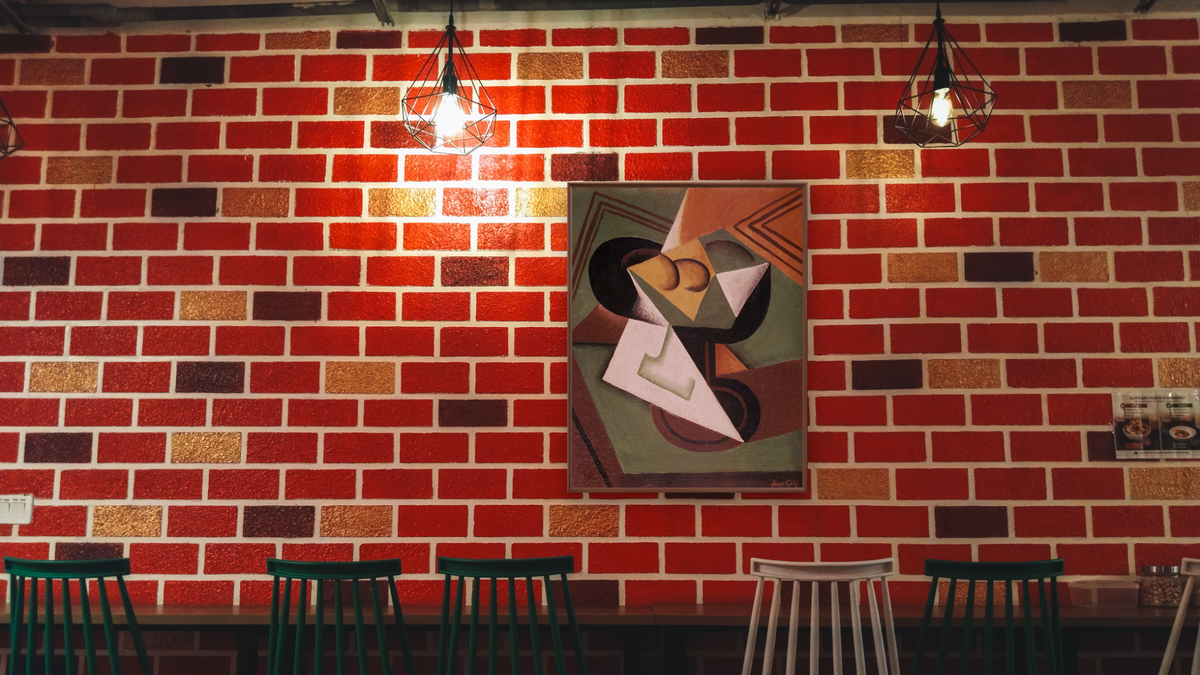 The Fruit Bowl by Juan Gris, shown at 32 × 40 in (81.3 × 101.6 cm) on canvas in Arber Warm Walnut, restaurant
