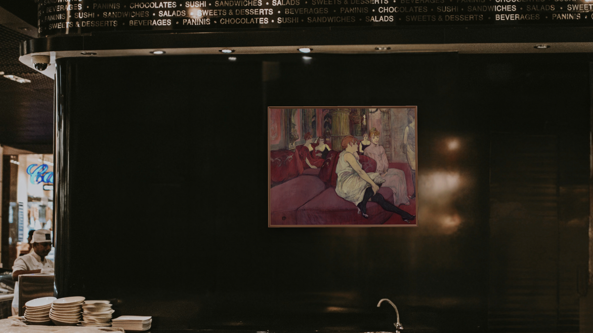 In the Salon at the Rue des Moulins by Henri de Toulouse-Lautrec, shown at 32 × 40 in (81.3 × 101.6 cm) on canvas in Arber Warm Walnut, restaurant