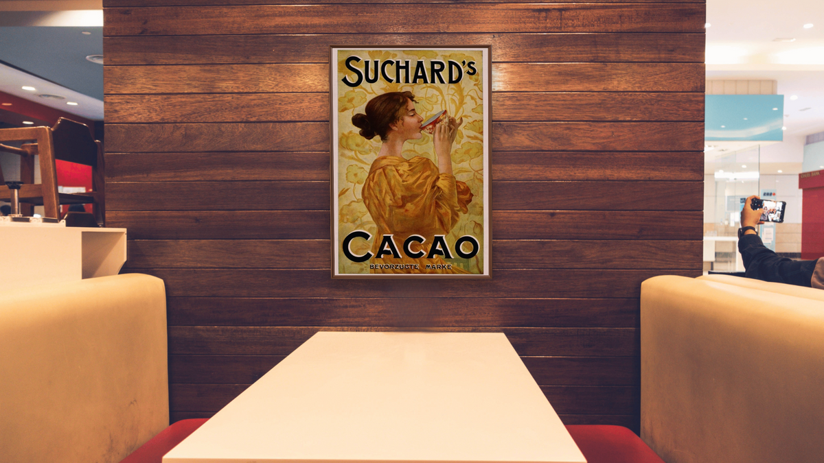 Suchard's Cacao by Unknown Artist, shown at 28 × 42 in (71.1 × 106.7 cm) on canvas in Arber Warm Walnut, restaurant