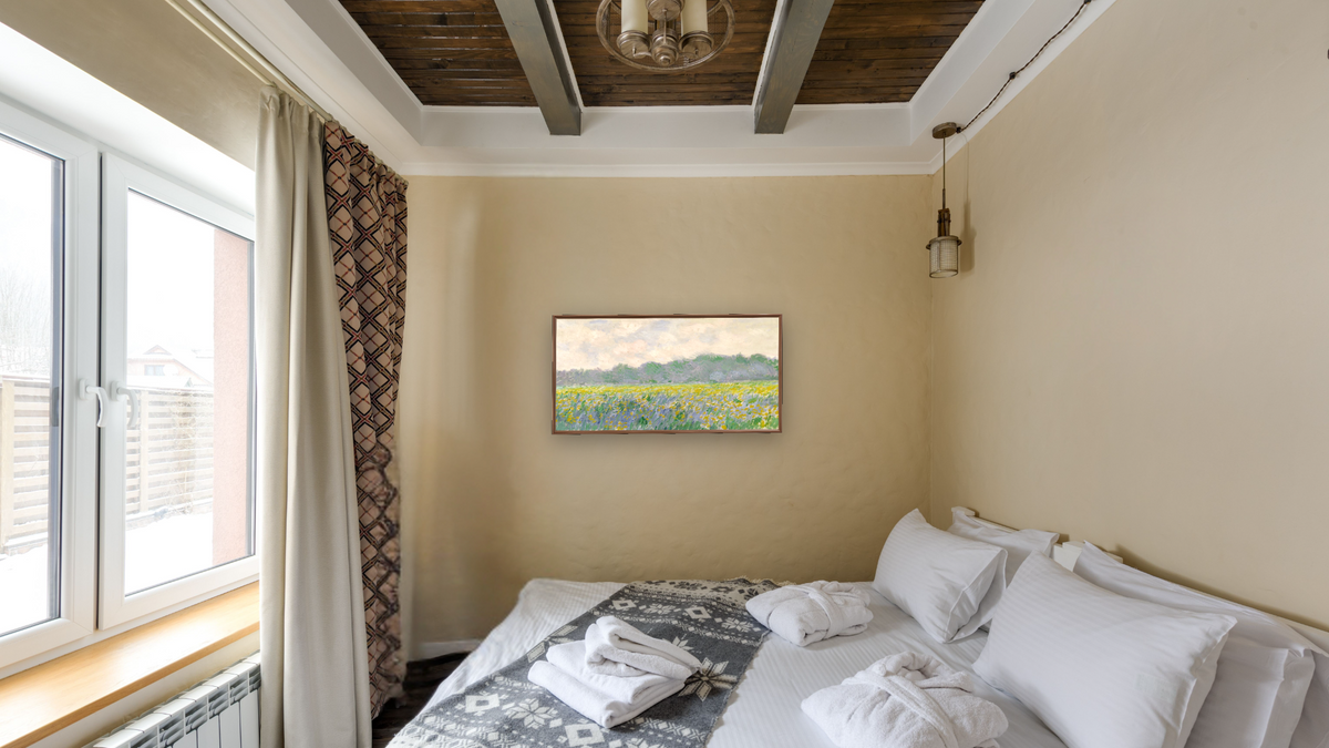 Field of Yellow Irises at Giverny by Claude Monet, shown at 20 × 40 in (50.8 × 101.6 cm) on canvas in Arber Warm Walnut, hotel guest room