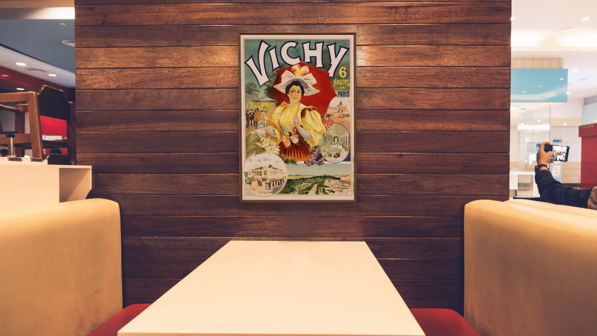 Vichy Poster by Sala, shown at 28 × 42 in (71.1 × 106.7 cm) on canvas in Arber Warm Walnut, restaurant