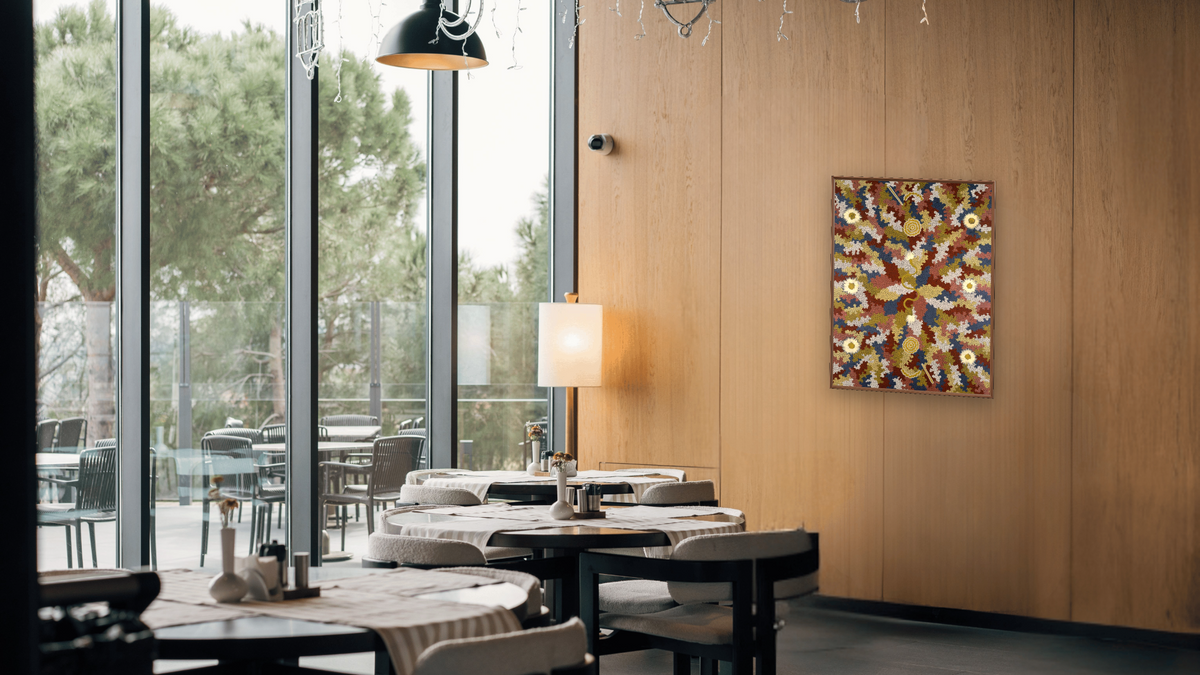 Men's Dreaming by Clifford Possum Tjapaltjarri, shown at 30 × 40 in (76.2 × 101.6 cm) on canvas in Arber Warm Walnut, restaurant
