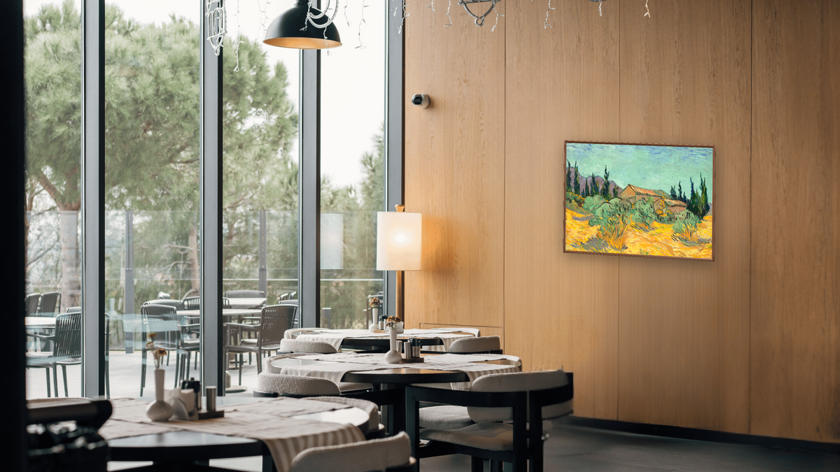 Huts surrounded by olive trees and cypresses by Vincent van Gogh, shown at 30 × 40 in (76.2 × 101.6 cm) on canvas in Arber Warm Walnut, restaurant