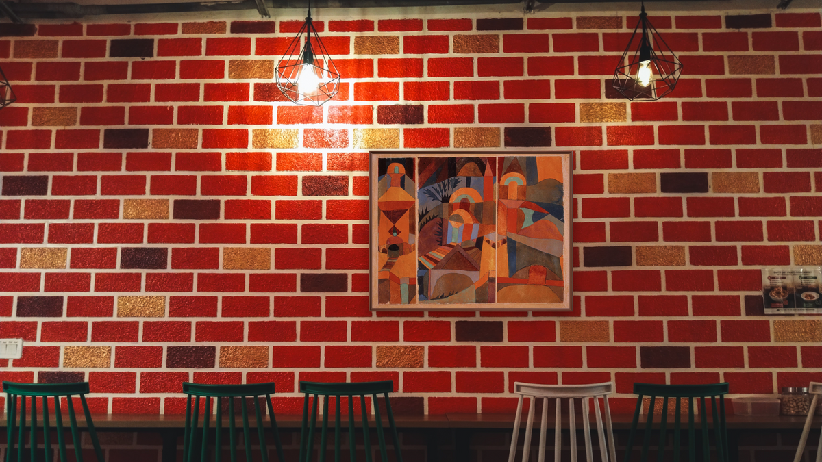 Temple Gardens by Paul Klee, shown at 30 × 40 in (76.2 × 101.6 cm) on canvas in Arber Warm Walnut, restaurant