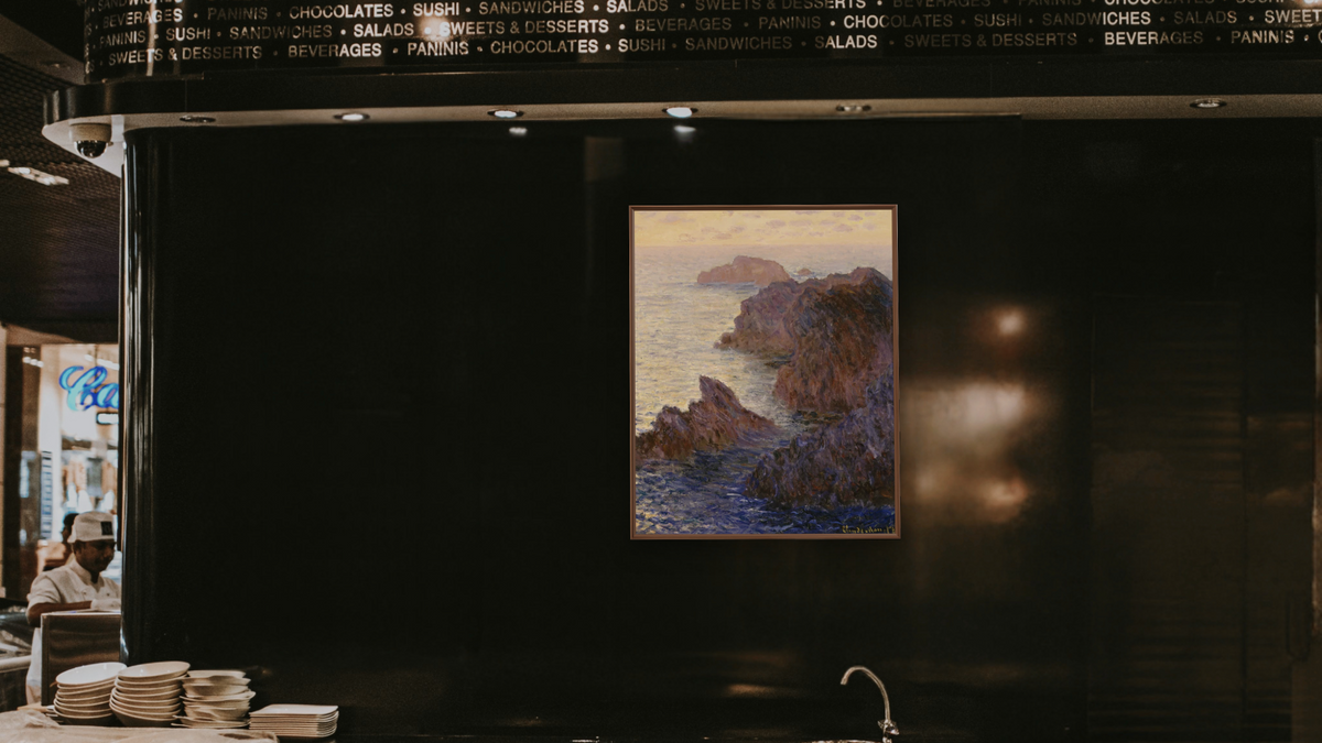 Rocky Point at Port-Goulphar by Claude Monet, shown at 32 × 40 in (81.3 × 101.6 cm) on canvas in Arber Warm Walnut, restaurant