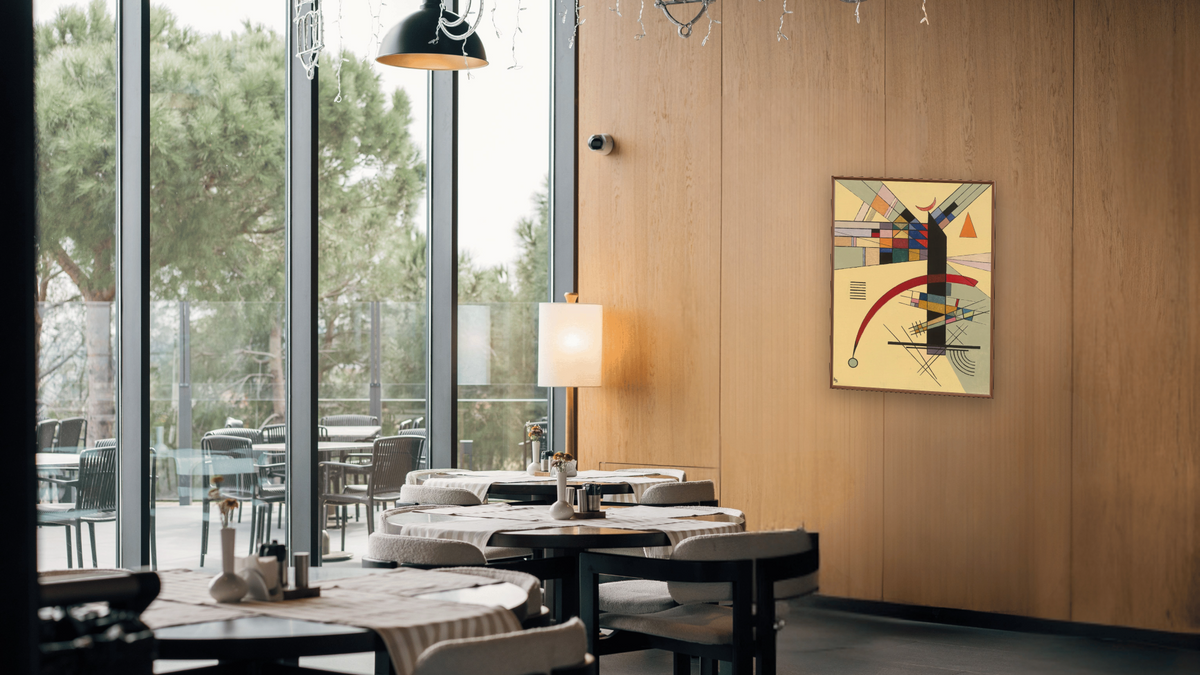 Small Yellow (Kleines Gelb) by Wassily Kandinsky, shown at 30 × 40 in (76.2 × 101.6 cm) on canvas in Arber Warm Walnut, restaurant
