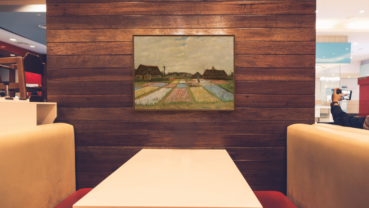 Flower Beds in Holland by Vincent van Gogh, shown at 30 × 40 in (76.2 × 101.6 cm) on canvas in Arber Warm Walnut, restaurant