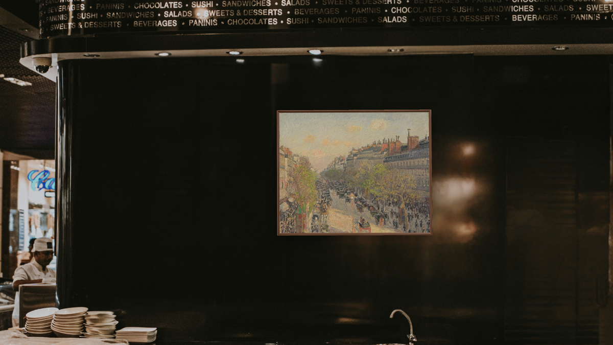 Boulevard Montmartre, Twilight by Camille Pissarro, shown at 32 × 40 in (81.3 × 101.6 cm) on canvas in Arber Warm Walnut, restaurant