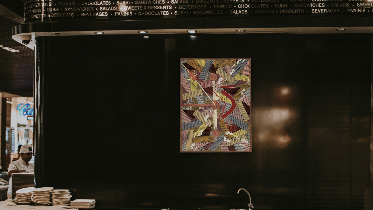 Man's Love Story by Clifford Possum Tjapaltjarri, shown at 30 × 40 in (76.2 × 101.6 cm) on canvas in Arber Warm Walnut, restaurant