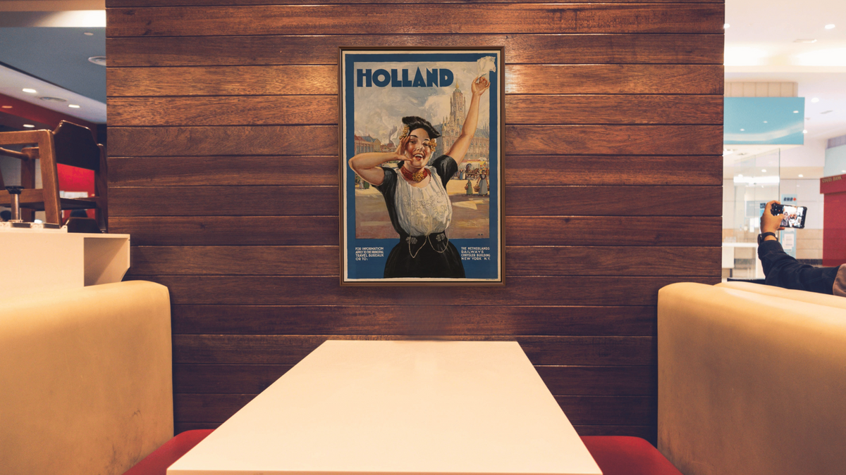 BPL Travel Posters, shown at 28 × 42 in (71.1 × 106.7 cm) on canvas in Arber Warm Walnut, restaurant