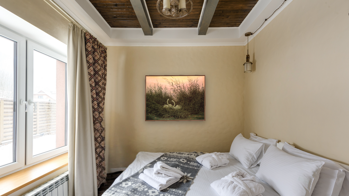Swans in the Reeds by Caspar David Friedrich, shown at 30 × 40 in (76.2 × 101.6 cm) on canvas in Arber Warm Walnut, hotel guest room