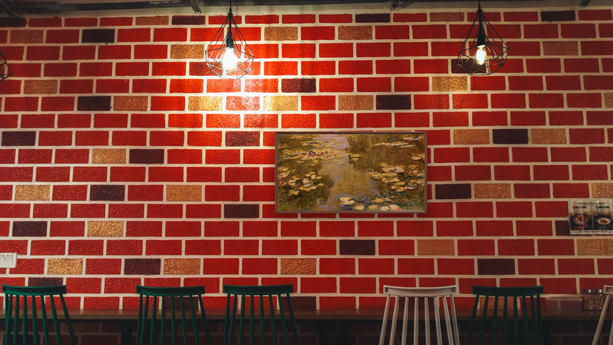 The Lily Pond by Claude Monet, shown at 20 × 40 in (50.8 × 101.6 cm) on canvas in Arber Warm Walnut, restaurant