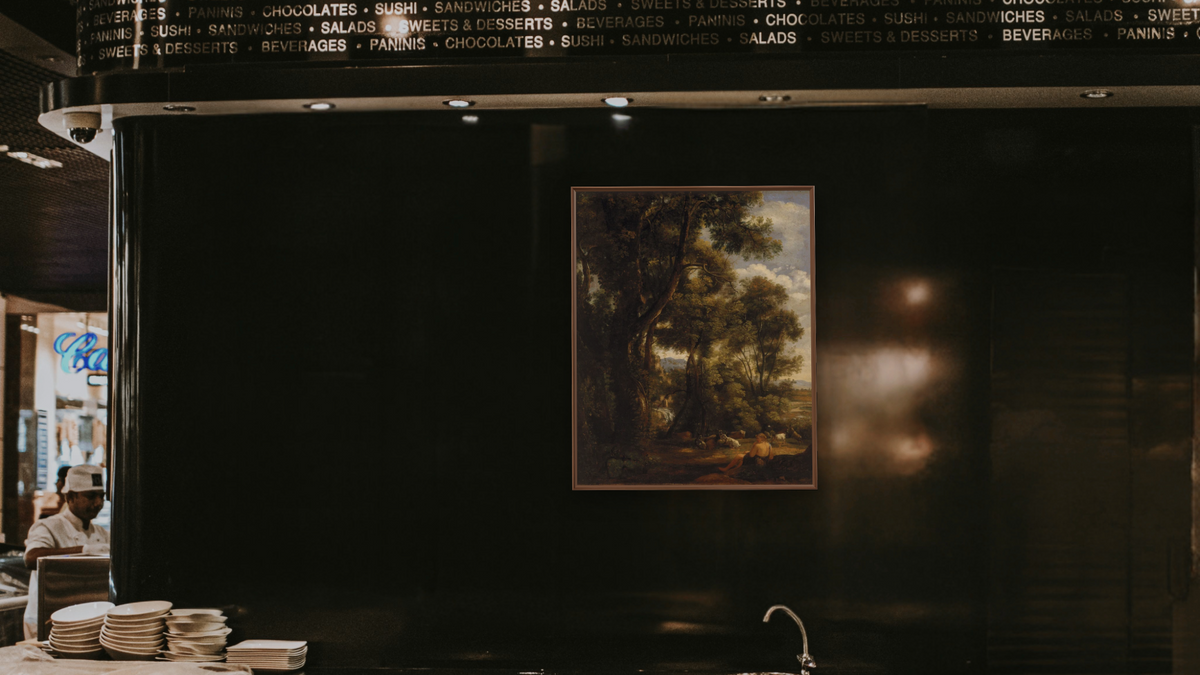 Landscape with goatherd and goats by John Constable, shown at 32 × 40 in (81.3 × 101.6 cm) on canvas in Arber Warm Walnut, restaurant