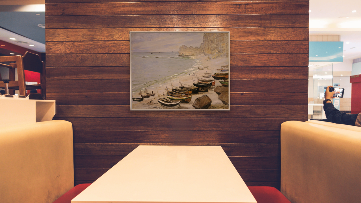 Boat on the Beach at Etretat by Claude Monet, shown at 32 × 40 in (81.3 × 101.6 cm) on canvas in Ramino Opaque White, restaurant