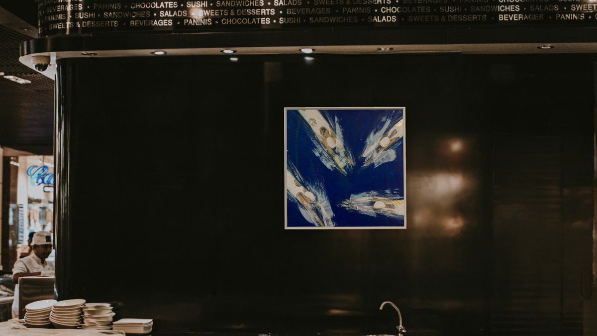 Cross Purposes by Dobee Snowber, shown at 32 × 32 in (81.3 × 81.3 cm) on canvas in Ramino Opaque White, restaurant