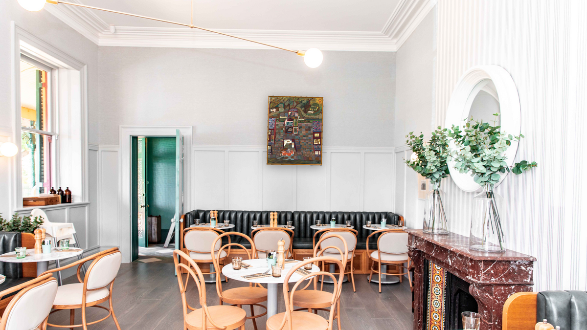 Sam's Dream by Ralph Fasanella, shown at 32 × 40 in (81.3 × 101.6 cm) on canvas in Molto Polished Gold, restaurant