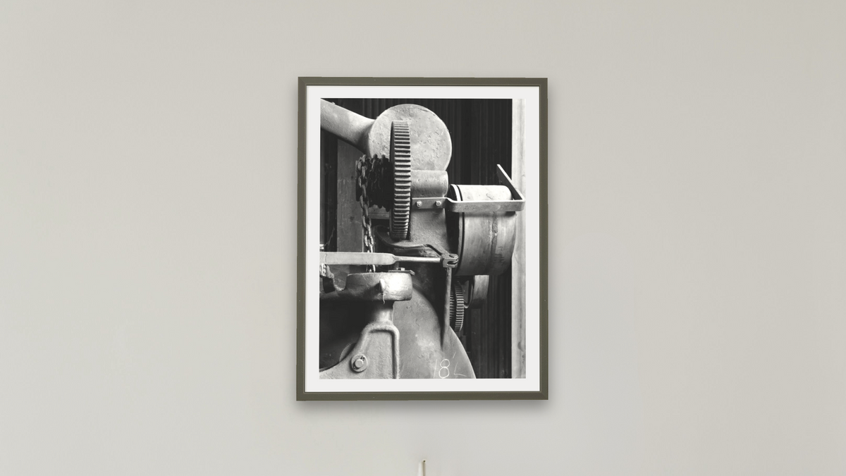Wheel Boring Machine #2 by Gordon Osmundson, shown at 30 × 40 in (76.2 × 101.6 cm) in Ramino Satin Black, boardroom
