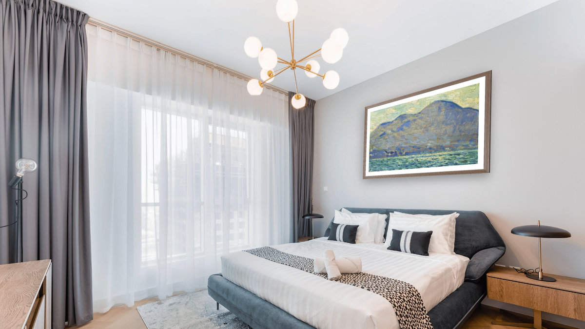 Mt. Beacon at Newburgh by Childe Hassam, shown at 28 × 42 in (71.1 × 106.7 cm) in Arber Light Walnut, hotel guest room