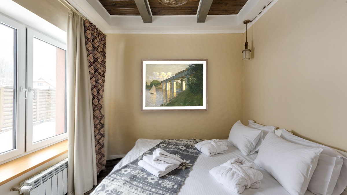 Railroad Bridge, Argenteuil by Claude Monet, shown at 30 × 40 in (76.2 × 101.6 cm) in Arber Light Walnut, hotel guest room