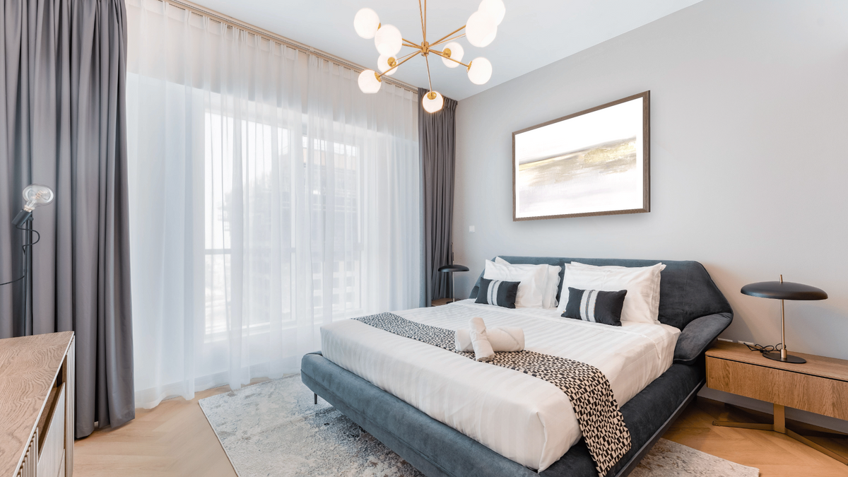 Gold Light by Dan Hobday, shown at 30 × 42 in (76.2 × 106.7 cm) in Arber Light Walnut, hotel guest room
