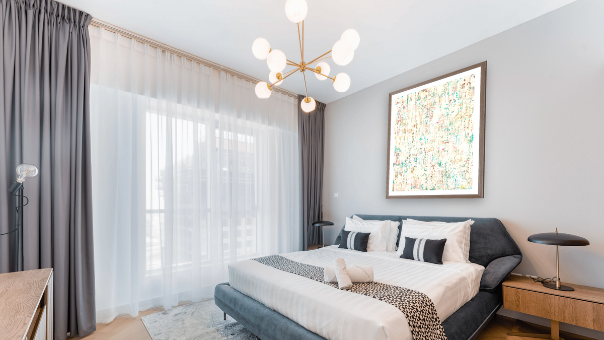Early Snow in The Garden by Emily Herrera, shown at 30 × 40 in (76.2 × 101.6 cm) in Arber Light Walnut, hotel guest room