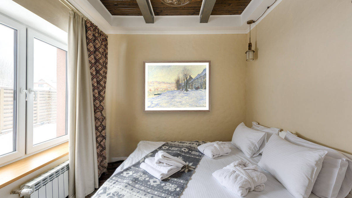 Lavacourt under Snow by Claude Monet, shown at 29 × 40 in (73.7 × 101.6 cm) in Arber Light Walnut, hotel guest room