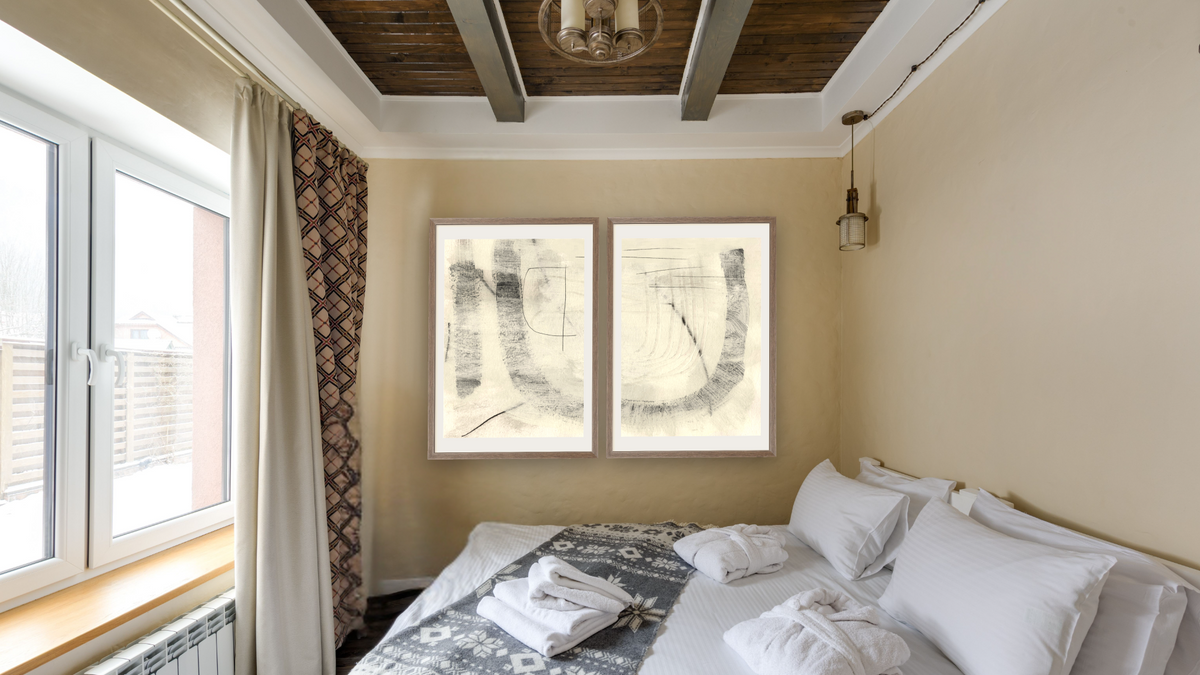 Diptych — Real 1 × Real 2, shown at 28 × 42 in (71.1 × 106.7 cm) in Arber Light Walnut, hotel guest room