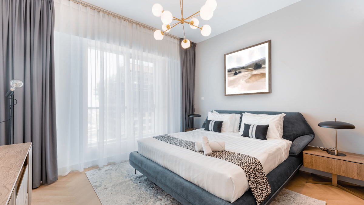 The Ranch by Dan Hobday, shown at 32 × 32 in (81.3 × 81.3 cm) in Arber Light Walnut, hotel guest room