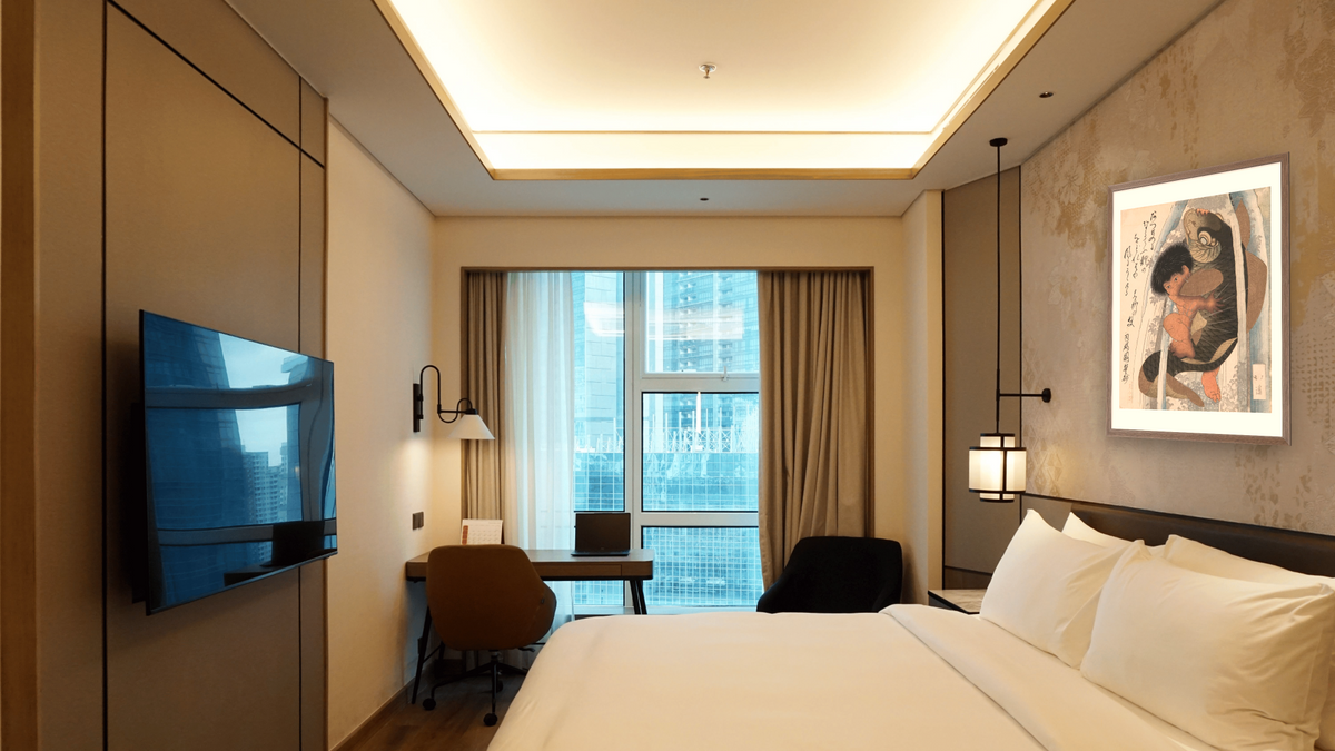 Kaidomaru Wrestling a Carp in a Cascade, shown at 32 × 40 in (81.3 × 101.6 cm) in Arber Light Walnut, hotel guest room