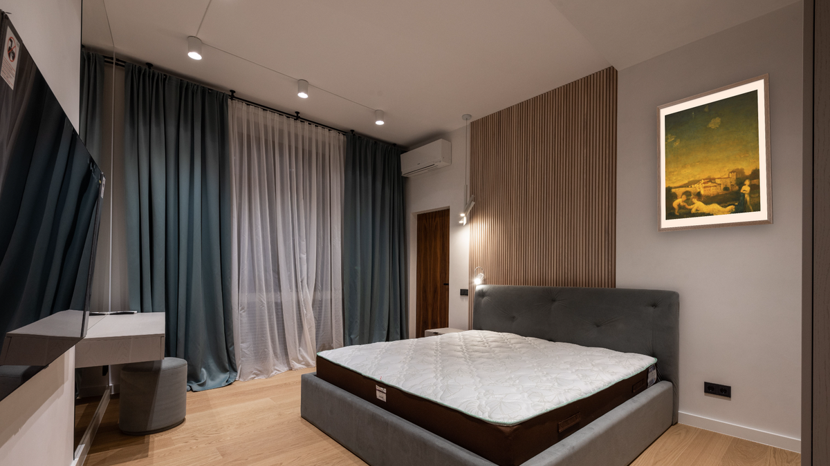 Viola Obligato by Arthur Bowen Davies, shown at 32 × 40 in (81.3 × 101.6 cm) in Arber Light Walnut, hotel guest room
