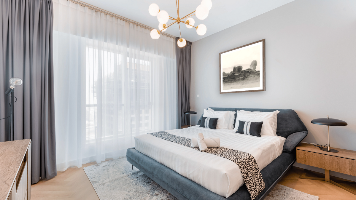 Land 2 SQ by Dan Hobday, shown at 32 × 32 in (81.3 × 81.3 cm) in Arber Light Walnut, hotel guest room