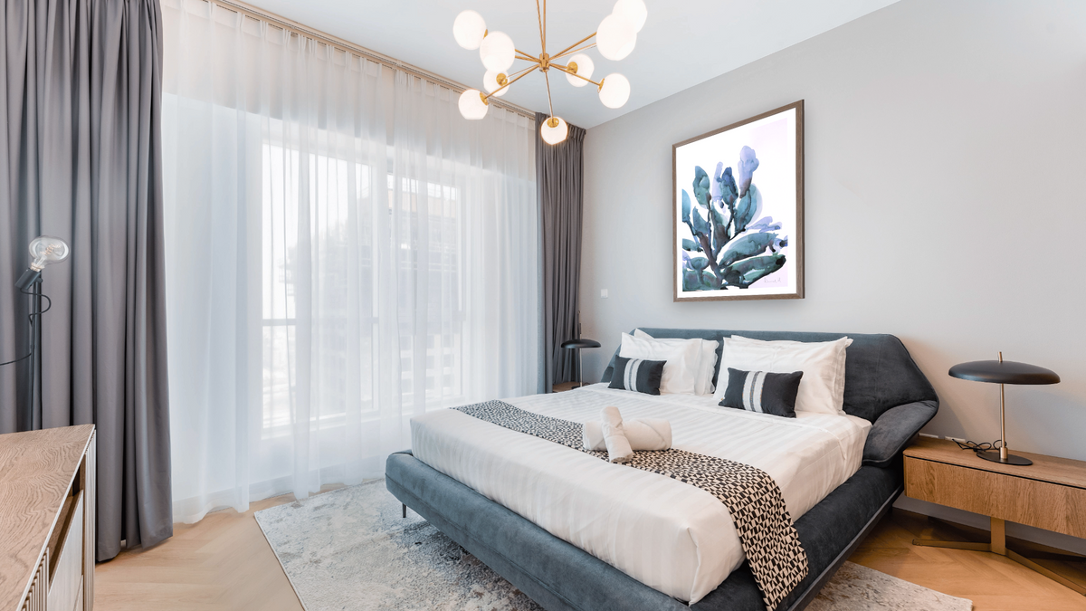Blue Plant by Dan Hobday, shown at 30 × 42 in (76.2 × 106.7 cm) in Arber Light Walnut, hotel guest room