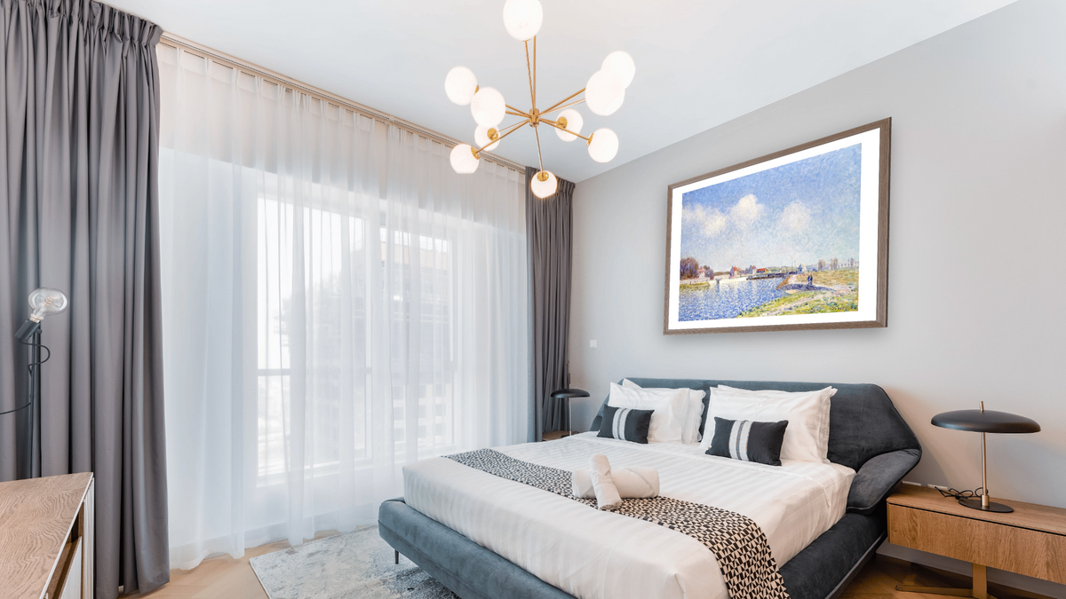 Le Barrage De Saint-Mammes by Alfred Sisley, shown at 32 × 40 in (81.3 × 101.6 cm) in Arber Light Walnut, hotel guest room