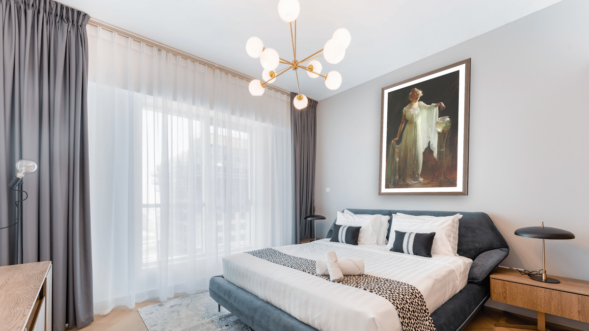 The Goldfish by Charles Courtney Curran, shown at 28 × 42 in (71.1 × 106.7 cm) in Arber Light Walnut, hotel guest room