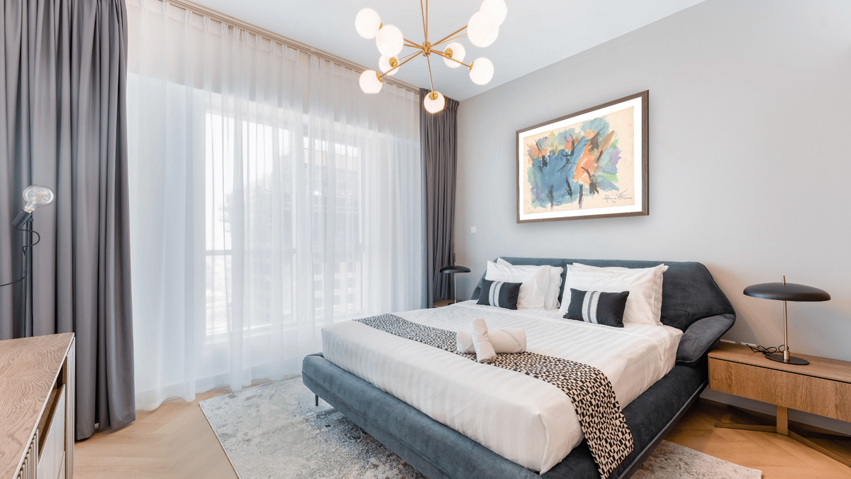 Untitled by Alma Thomas, shown at 31 × 40 in (78.7 × 101.6 cm) in Arber Light Walnut, hotel guest room