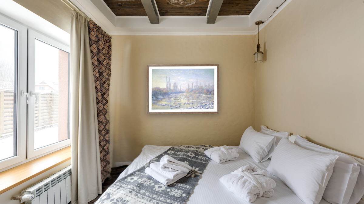 Les Glacons (The Ice Floes) by Claude Monet, shown at 27 × 42 in (68.6 × 106.7 cm) in Arber Light Walnut, hotel guest room